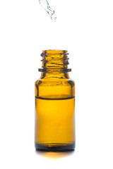 Brown medicine glass bottle with dropper isolated over white