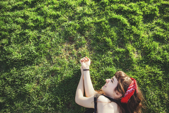 Caucasian Woman Laying In Grass