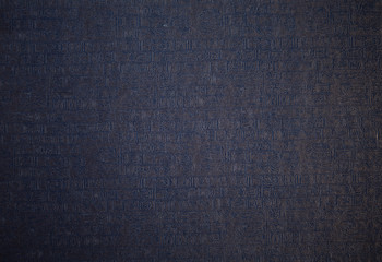 Hieroglyph texture closeup. Grunge paper with hieroglyphics with magnifier closeup. Nice background for any ideas.