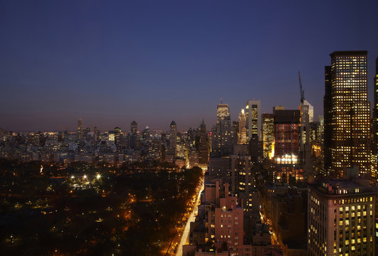 Sunset and illuminated cityscape, New York, New York, United States