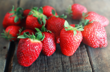 fresh strawberries on a wooden background