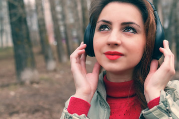 girl in park with headphone