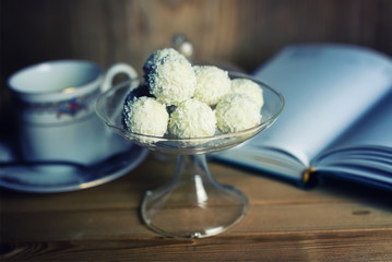 reading book with tea flower and sweet