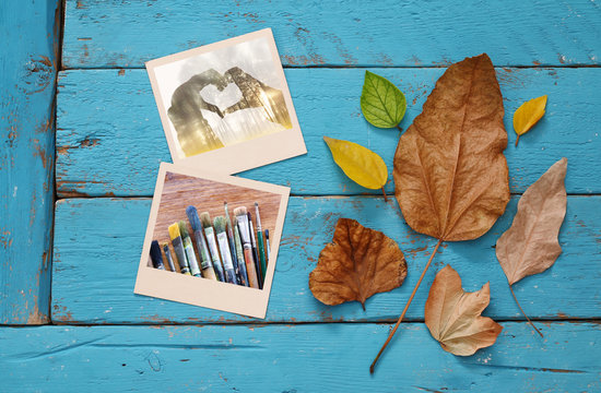 Autumn background with dry leaves and old photo frames