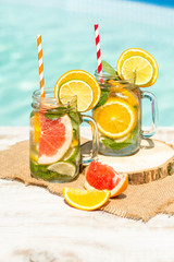 Detox citrus infused water as a refreshing summer drink.