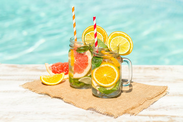 Detox citrus infused water as a refreshing summer drink.