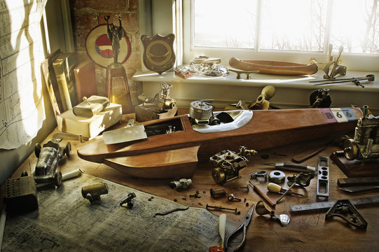 Boat, map, and sailing paraphernalia on desk