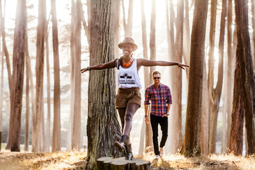 Couple exploring sunny forest