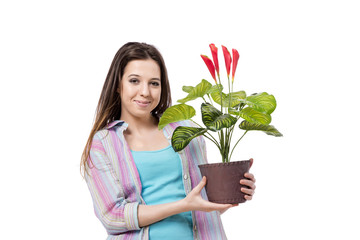 Young woman taking care of plants isolated on white