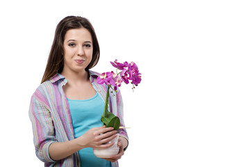 Young woman taking care of plants isolated on white