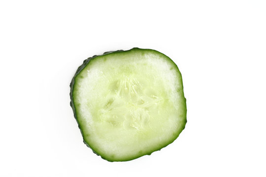 Sliced cucumber on white isolated background