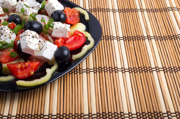 Side view of the Greek vegetarian salad of tomatoes, cucumbers,