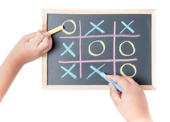 boy and girl hand drawing a game of tic tac toe