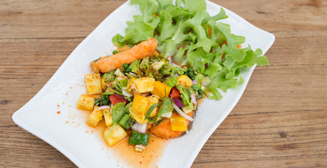 Salmon fish sauce dressing, vegetables, fruit.