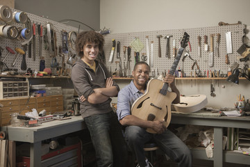 Father and son in music workshop