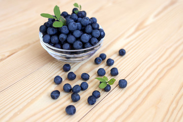 Blueberry on wooden background. Blueberry close up and blueberry background. Berries closeup. 
