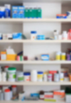 close up blur shelves of drugs in the pharmacy