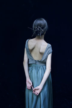 Rear view of woman wearing backless dress