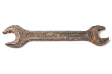 Old rusty wrench on the white background