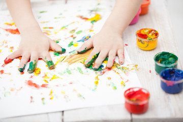 child playing with paint close up
