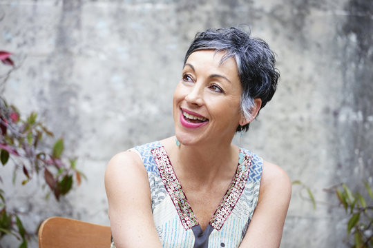 Older Caucasian woman sitting outdoors
