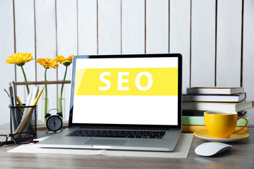 SEO technology concept. Modern workplace interior.
