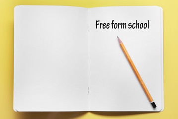 Home learning concept. School notebook on color background