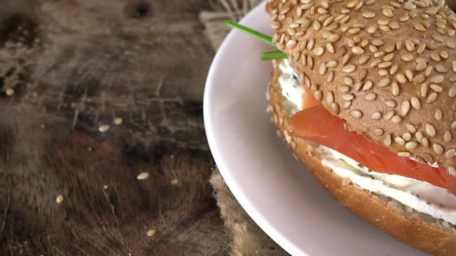 Portion of rotating Bagels with Salmon as seamless loopable 4K UHD footage