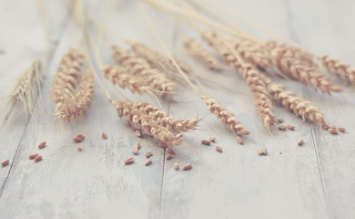 Ears of wheat on a wooden table