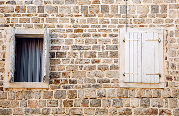 Fototapeta na wymiar old wall with wooden windows