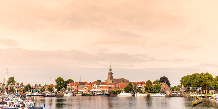 View at the historic harbor with yachts in the Dutch village of