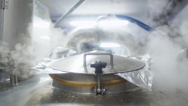  Close up of industrial machine boiling ingredients in a brewery