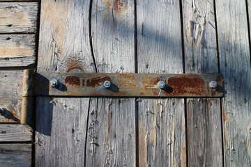Hinge with screws on wooden door