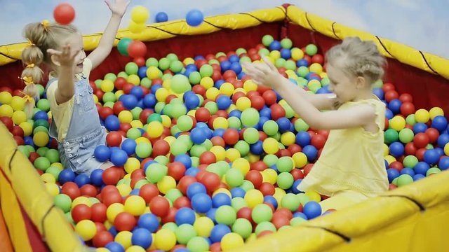 children playing in the ball pool