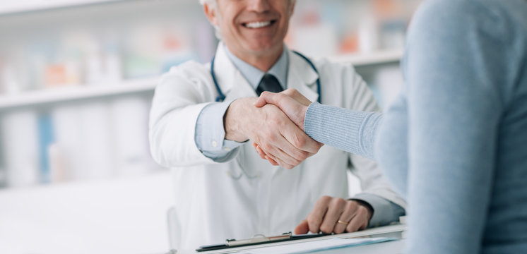 Doctor And Patient Shaking Hands