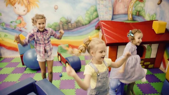 children jumping in the playroom