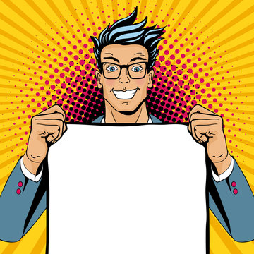 Wow pop art man. Young happy surprised man in glasses with open smile holding empty poster. Vector illustration in retro comic style. Vector pop art background.