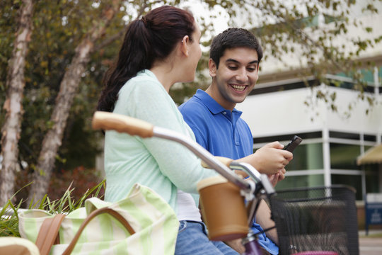 Smiling students talking on campus
