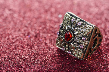 Jewellery ring against shiny background