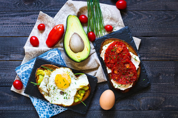 Delicious Tasty Avocado Eggs and Tomato Cheese Toasts