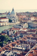 Obraz premium Aerial View of the Grand Canal and Basilica Santa Maria della Salute, Venice, Italy. European summer vacation concept. Vintage color post processed