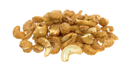 Pieces of honey roasted cashews on a white background