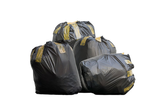 Group of black garbage bags put fully covered with adhesive tape isolated on white background.