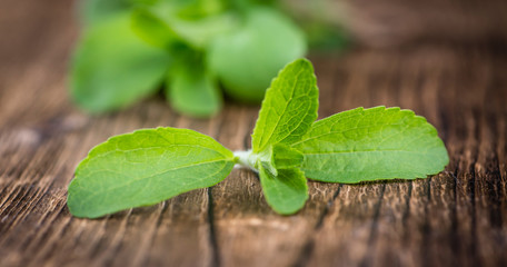 Vintage wooden table with Stevia leaves