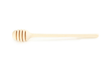 Wooden honey dipper isolated on a white
