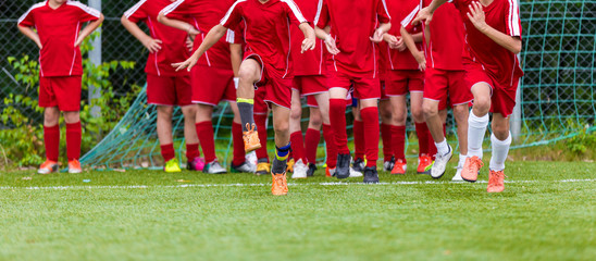 Youth Soccer Group Training Session. Stretching - Flexibility Exercises for Youth Soccer Players. Training Session and Warm Ups Before The Football Match. © matimix