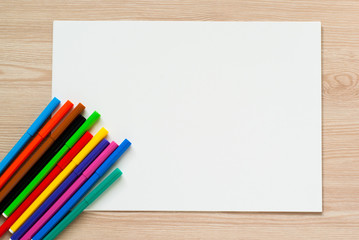 Obraz premium Pencils, crayons and album sheet