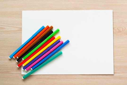 Pencils, crayons and album sheet