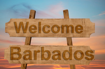 Welcome to  Barbados sing on wood background