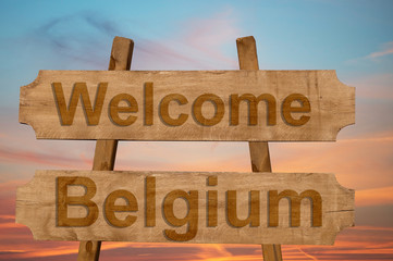 Welcome to  Belgium sing on wood background